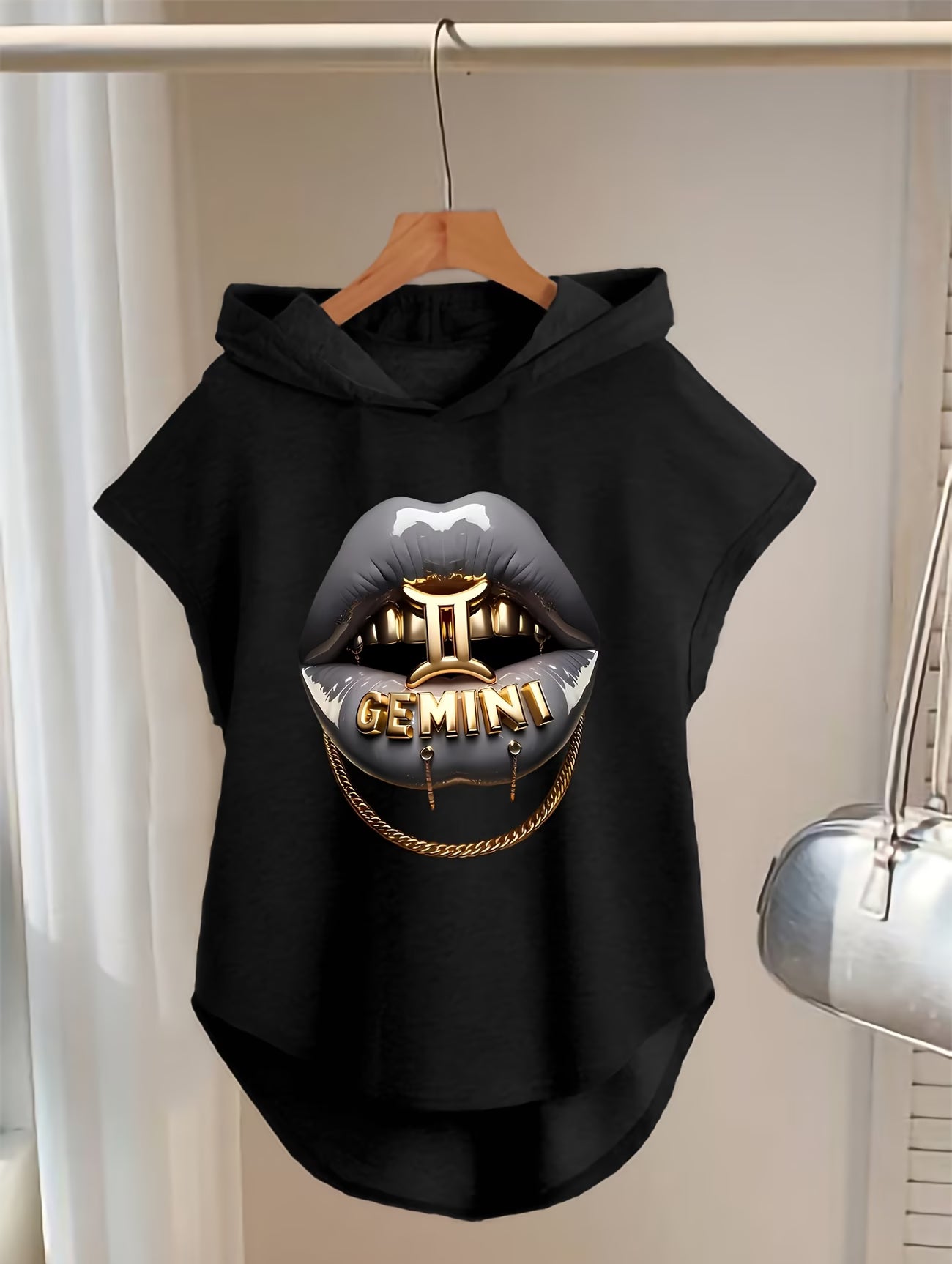 Sleeveless Hoodie Featuring a Cartoon Lip Biting a Key Design